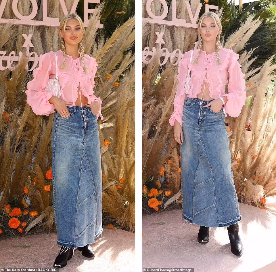 Người đẹp Thụy Điển Elsa Hosk mặc áo xuyên thấu bèo nhún màu hồng "quên" nội y, chân váy jean dáng dài, boot đen mũi nhọn.