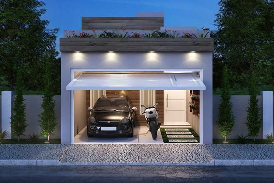 Với mẫu nhà ống trong hình, gia chủ có thể ốp gỗ làm lan can chắn rồi tận dụng phần khoảng trống phía trên mái để trồng hoa, tăng tính thẩm mĩ. Phần cửa cấu tạo 1 khoảng trống để ô tô và các phương tiện khác. Phía mặt tiền kết hợp sử dụng đá có hoa văn, làm điểm nhấn cho căn nhà.