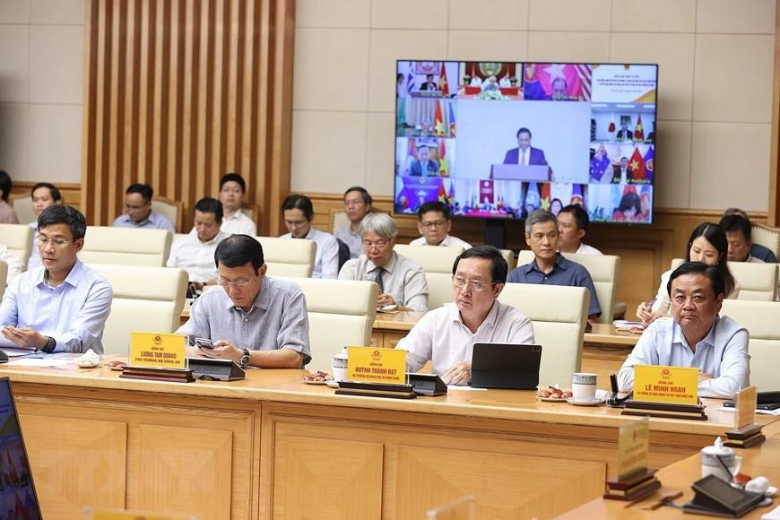 Đại diện các bộ, ngành tham dự hội nghị tại điểm cầu Chính phủ. (Ảnh: Dương Giang/TTXVN)