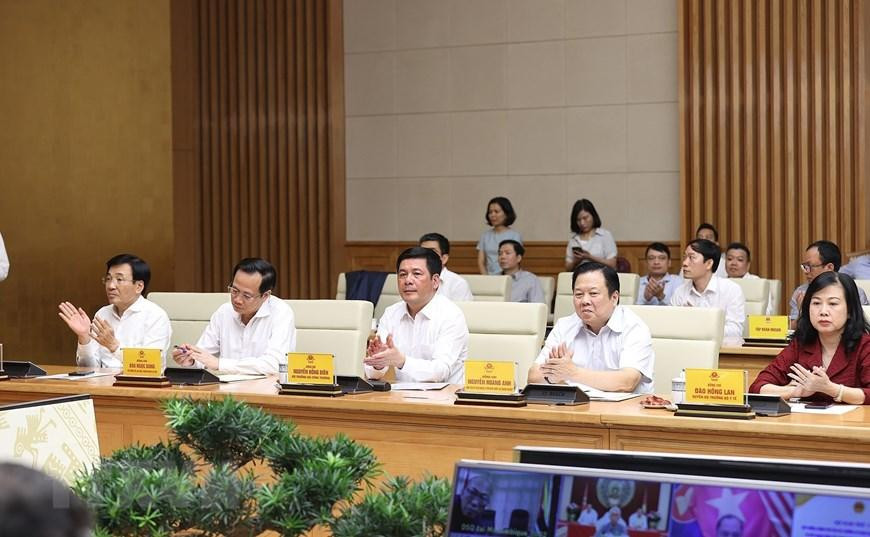 Đại diện các bộ, ngành tham dự hội nghị tại điểm cầu Chính phủ. (Ảnh: Dương Giang/TTXVN)