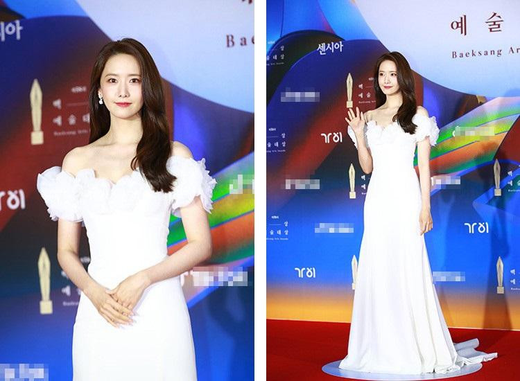Yoona (SNSD) thanh lịch, ngọt ngào trong đầm trắng có đường viền cổ bèo nhún. Cô đã được đề cử cho "Nữ diễn viên chính xuất sắc nhất - mảng điện ảnh" cho vai diễn trong “The Miracle”.