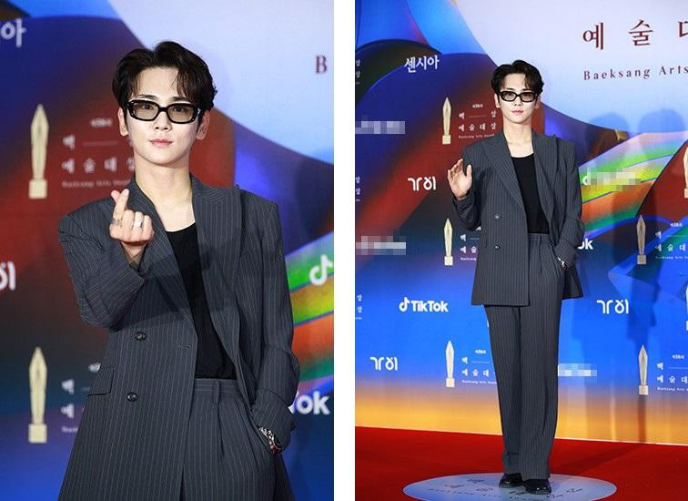 Key (Shinee) trông cá tính và thời trang khi kết hợp vest với áo thun cổ tròn và kính râm phong cách.