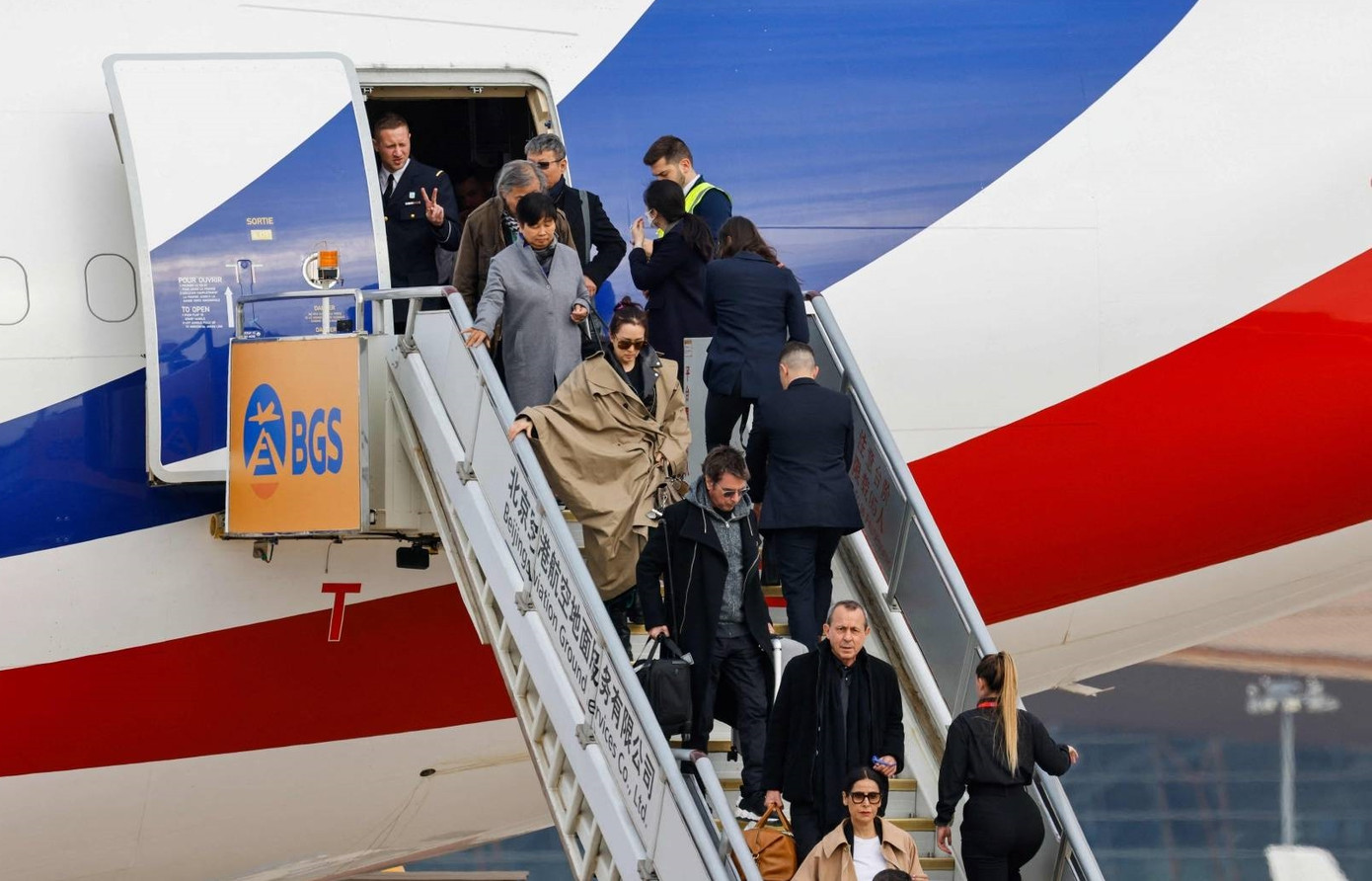 Vợ chồng Củng Lợi tháp tùng Tổng thống Pháp trong chuyến sang thăm Trung Quốc.