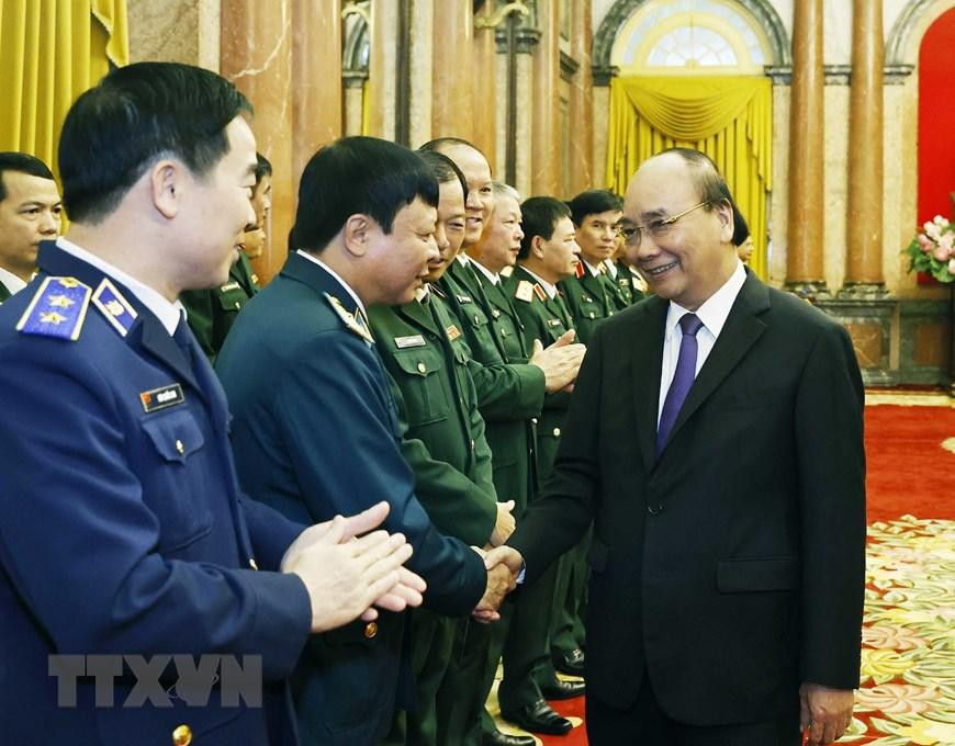 Chủ tịch nước Nguyễn Xuân Phúc và các đại biểu tham dự buổi lễ. (Ảnh: Thống Nhất/TTXVN)