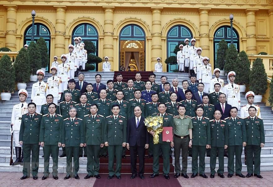 Chủ tịch nước Nguyễn Xuân Phúc và các đại biểu tham dự buổi lễ. (Ảnh: Thống Nhất/TTXVN)