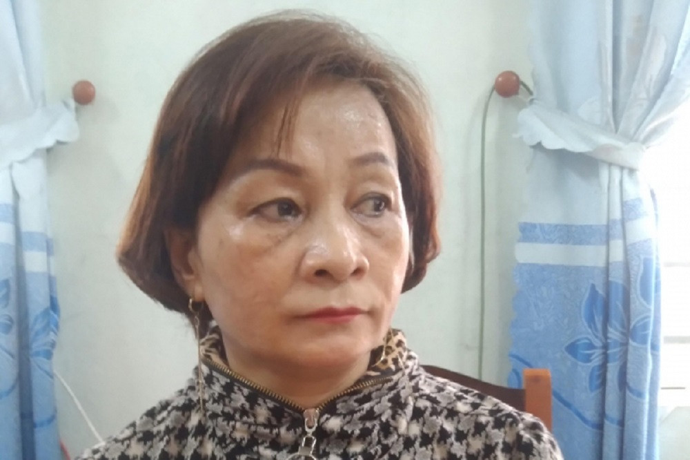 Bà Lê Thị Lan tại cơ quan điều tra. Ảnh: CACC