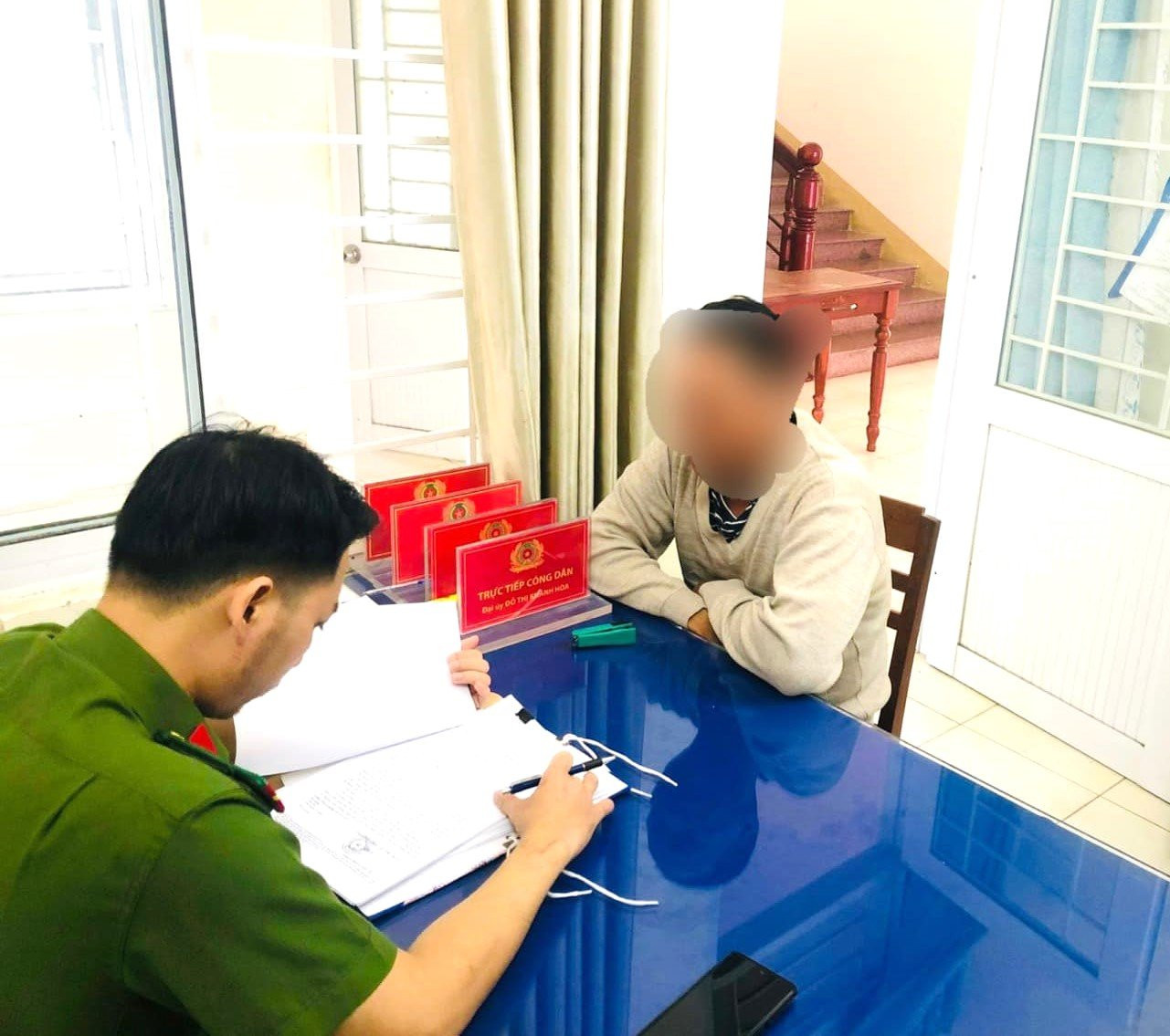 Ông P.T.M tại cơ quan Công an.