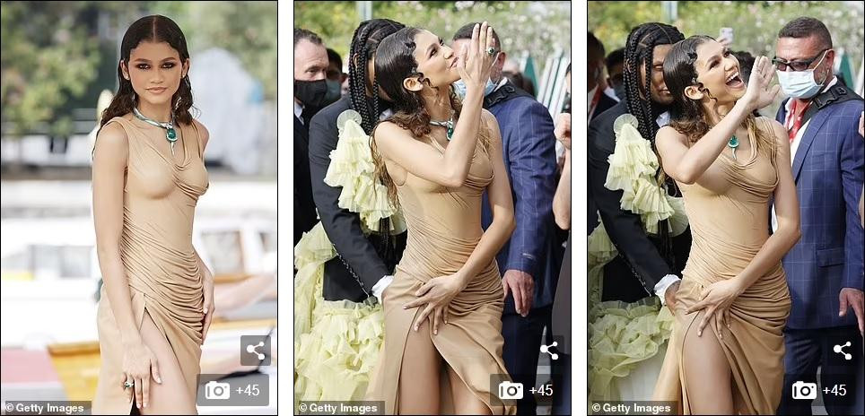 Thiết kế xẻ tà cao vút giúp bạn gái "Người Nhện" khoe được đôi chân dài nuột miên man, nhưng cũng gây chút bất tiện vì người đẹp liên tục phải giữ váy để tránh hớ hênh.