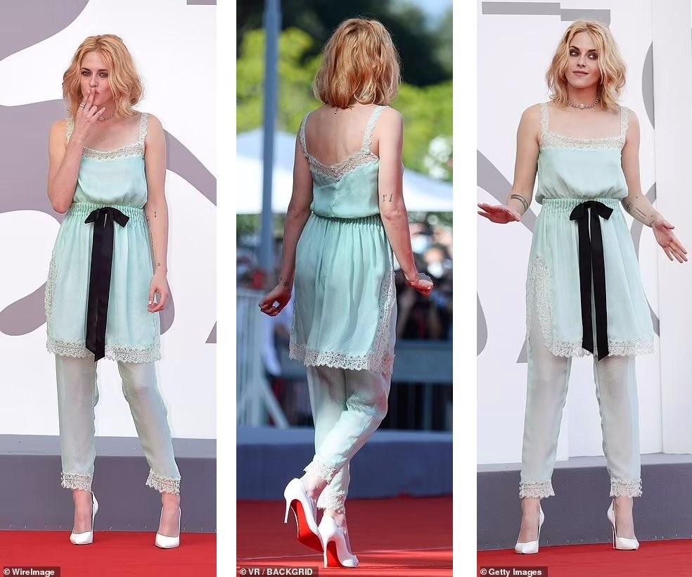 Trong khi hầu hết sao nữ xuất hiện trong những bộ váy dự tiệc lộng lẫy, người đẹp sinh năm 1990 mặc set đồ gồm áo hai dây xẻ tà và quần dài bằng chất liệu satin bạc hà phối với ren trắng, không khác gì đồ ngủ. Cô còn "quên" nội y và để kiểu tóc xoăn hơi rối như vừa ngủ dây. Món đồ duy nhất phù hợp với thời trang thảm đỏ là đôi giày cao gót màu trắng của Louboutin.