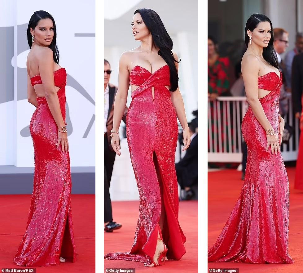 &quot;Hot&quot; nhất thảm đỏ Venice ngày 1 không ai có thể vượt qua cựu thiên thần nội y Brazil Adriana Lima. Mỹ nhân 40 tuổi khoe vòng một &quot;bốc lửa&quot; trong đầm quây đỏ lấp lánh, với những đường cắt xẻ táo bạo.