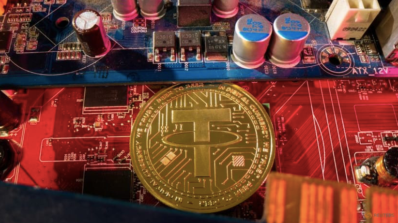 Hình đại diện của đồng tiền điện tử ổn định Tether. (Đồ hoạ: Reuters) Hình đại diện của đồng tiền điện tử ổn định Tether. (Đồ hoạ: Reuters)