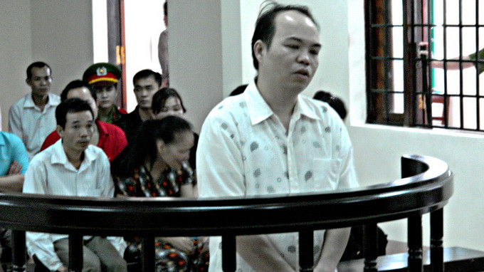 Bị cáo Vi Anh Tuấn, nguyên phó văn phòng Cơ quan cảnh sát điều tra Công an Hà Giang, tại phiên tòa phúc thẩm - Ảnh: Quang Tiến