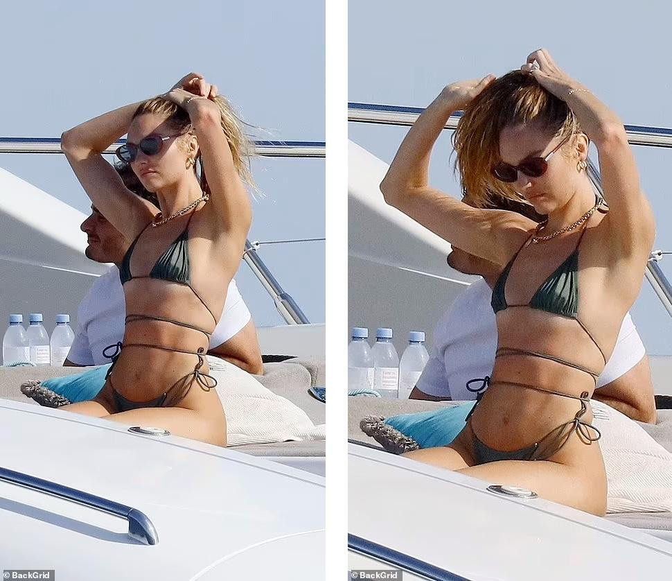 Cuối tuần qua, Candice Swanepoel được nhìn thấy tắm nắng trên du thuyền trên biển ở French Riviera (Pháp). &quot;Chân dài&quot; 33 tuổi mặc bộ bikini siêu bé màu xanh rêu khoe hình thể mảnh mai, săn chắc, đặc biệt là vòng hai phẳng lì, không chút mỡ thừa.