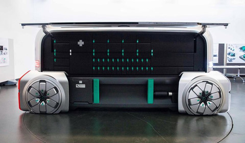 Xe trông như một robot lớn, màu xám có những chiếc bánh xe nhìn có vẻ hơi vuông. Đây là mẫu phương tiện dự kiến có mặt trên đường phố khoảng năm 2030. ẢNH: BLOOMBERG.