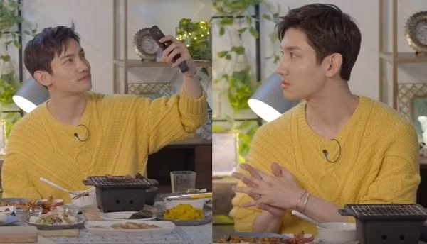 Changmin (TVXQ) khoe áo mới trong một show truyền hình.