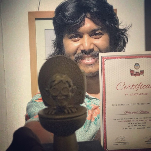 Chân dung người họa sĩ yêu hòa bình Morshed Mishu. Ở Bangladesh, Mishu là họa sĩ có tiếng trong giới vẽ tranh cổ động, tranh biếm họa cho các tạp chí và các tổ chức phi chính phủ.