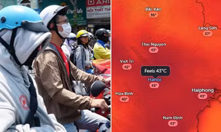 Người dân Hà Nội che nắng khi nhiệt độ ngoài trời tăng cao