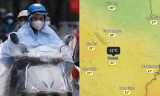 Người dân Hà Nội đi dưới mưa do không khí lạnh