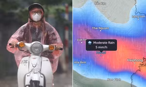 Người dân Hà Nội di chuyển trong mưa