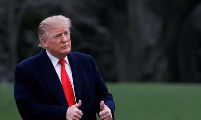 Phản ứng của ông Trump khi nghe kết luận của cuộc điều tra. (Ảnh: Carlos Barria)