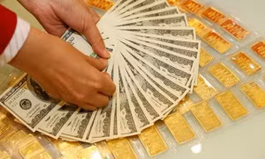 Giá vàng đồng loạt giảm, tỷ giá USD hạ nhiệt 