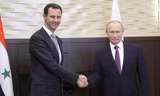 Tổng thống Nga Vladimir Putin gặp người đồng cấp Syria Bashar Assad tại Sochi hôm 20/11. Ảnh: Reuters