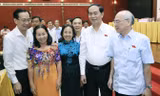 Chủ tịch nước Trần Đại Quang với các đại biểu tại hội nghị tiếp xúc cử tri. Ảnh: Nhan Sáng/TTX.