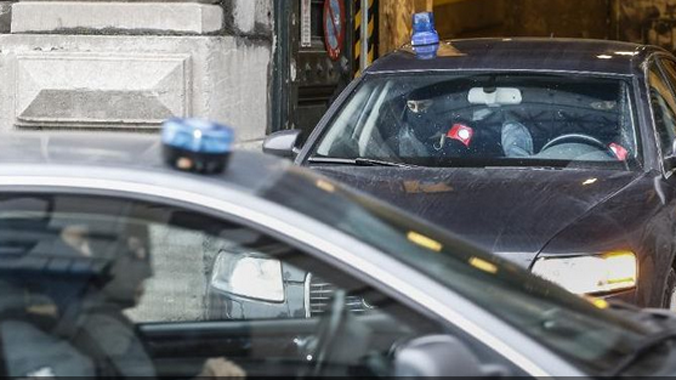 Nghi can trong xe cảnh sát ngày 21/1 (Ảnh: Channel News Asia)