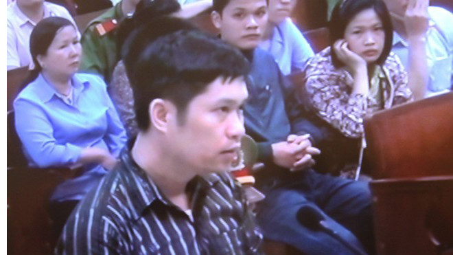 Nguyễn Mạnh Tường tại phiên xử ngày 14/4/2014.