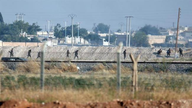 Các chiến binh người Kurd ở thị trấn Tal Abyad. Ảnh: Press TV. 