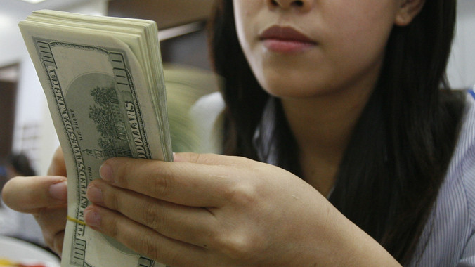 Tỷ giá VNĐ/USD được dự kiến sẽ điều chỉnh 2% trong năm nay. Ảnh: Như Ý