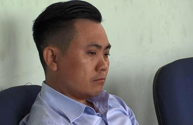 Trần Quốc Luật tại cơ quan công an