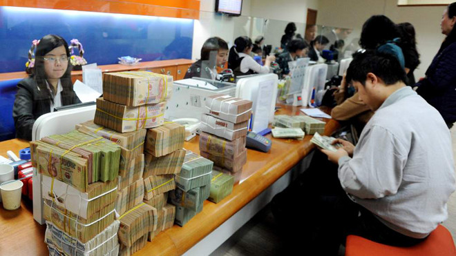 Ngân hàng nhà nước cũng đang nghiên cứu đề án kiểm soát và tiêu dùng bằng tiền mặt. Ảnh: Hồng Vĩnh