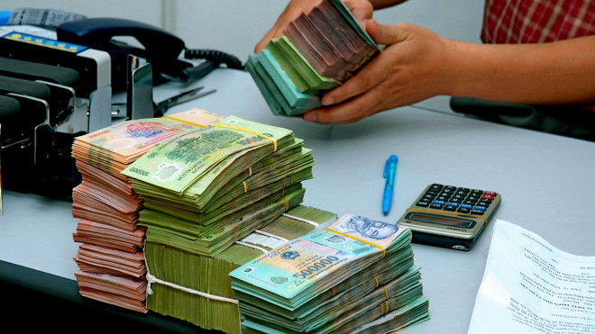 Hết tháng 1/2014, tăng trưởng tín dụng vẫn âm 0,5% so với 31/12/2013. Ảnh: Như Ý