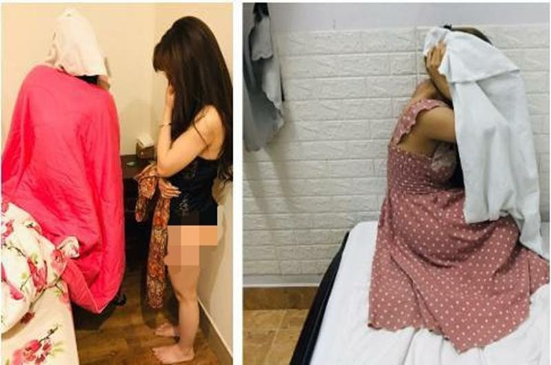 Hai cô gái bán dâm trong nhà nghỉ bị công an bắt quả tang. 