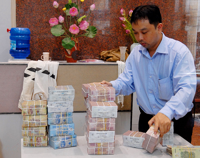 Các chuyên gia cho rằng, cần cho phép bán dưới mệnh giá thì nợ xấu mới giải quyết được. Ảnh: Ngọc Châu