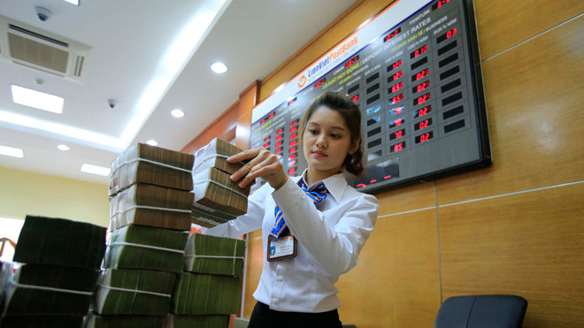 Ngân hàng tồn đọng tiền, nhưng lãi suất cho vay vẫn cao (ảnh minh họa). ảnh: như ý