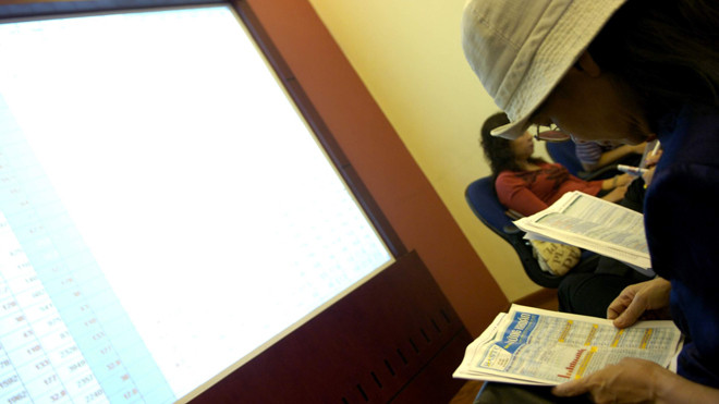 Công ty chứng khoán lãi lớn còn giới đầu tư thì đau đầu vì sự trồi sụt của thị trường. Ảnh: Như Ý