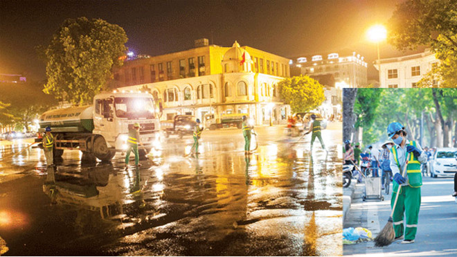 Công nhân của Cty Môi trường Đô thị làm sạch đường phố.