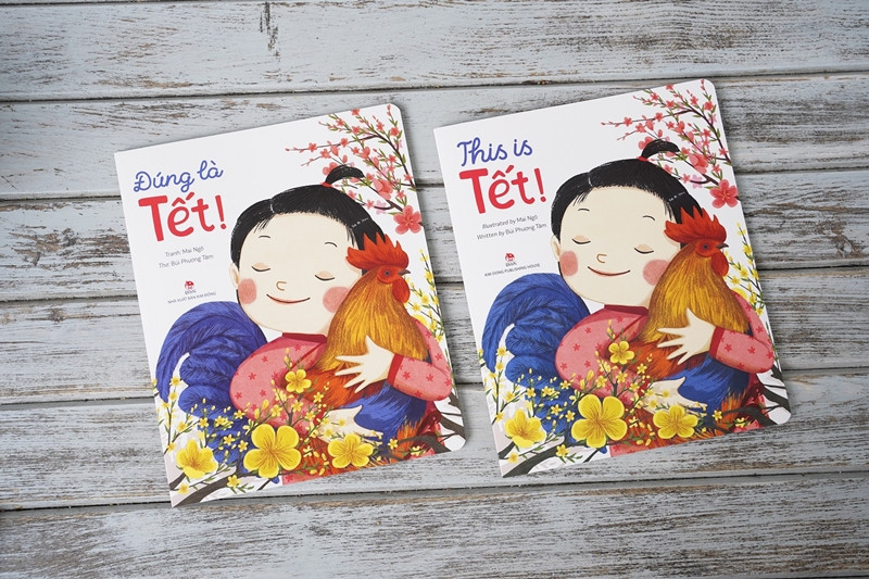 Trong đợt tái bản đầu năm 2021, "Đúng là Tết" chính thức phát hành bản tiếng Anh "This is Tết" dành cho các bạn nhỏ - Ảnh: Kim Đồng “Thực đơn” sách Tết: Chạm vào trang nào cũng thấy mùa Xuân, đậm đà hương vị Tết ảnh 5