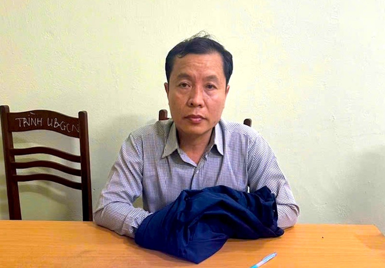Đối tượng Phạm Quang Đạo tại cơ quan công an. tien-phong.jpg