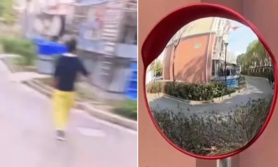 Người phụ nữ chỉnh gương cầu lồi trên phố theo phong thủy, gây ra nhiều tai nạn