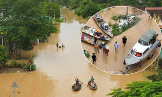 Lũ trên sông Lam dâng cao, quốc lộ hóa sông, người dân chèo thuyền sơ tán tài sản