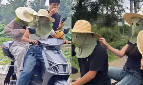Trời nóng đỉnh điểm, giới trẻ tận dụng lá sen làm "phương tiện" chống nắng độc đáo