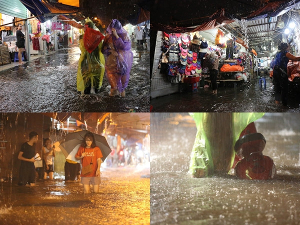 Hà Nội bất chợt mưa lớn, chợ Nhà Xanh ngập lụt khiến người dân đi lại khó khăn