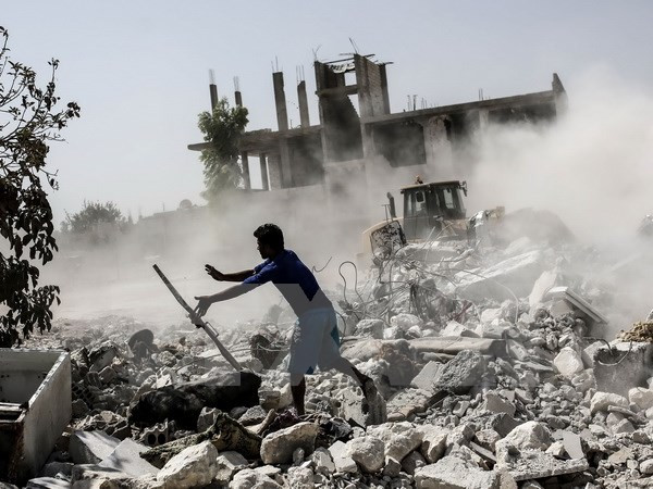 Cảnh đổ nát tại Kobane, miền bắc Syria sau các cuộc giao tranh với lực lượng PKK. (Nguồn: AFP/TTXVN)