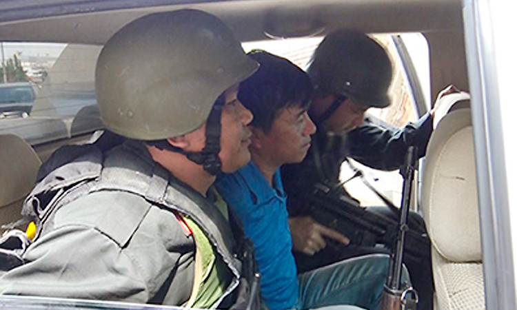 Nghi can người Trung Quốc bị bắt. Ảnh: Q.T