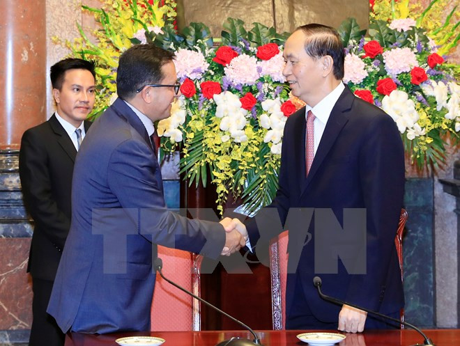 Chủ tịch nước Trần Đại Quang tiếp đoàn đại biểu các Hội Chữ thập đỏ-Trăng lưỡi liềm đỏ quốc tế, khu vực. (Ảnh: Nhan Sáng/TTXVN)