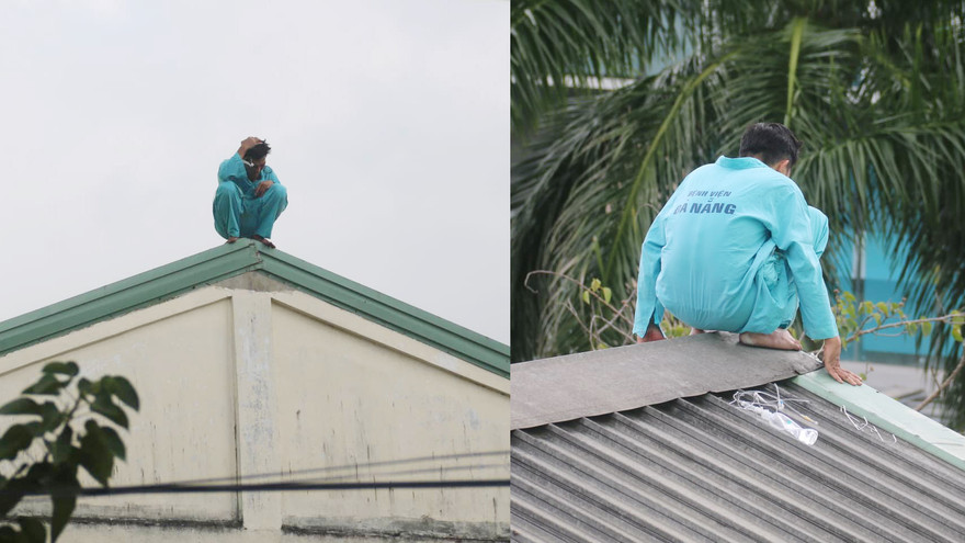 Người đàn ông ngồi trên nóc nhà E bệnh viện Đà Nẵng. Ảnh: Nguyễn Thành