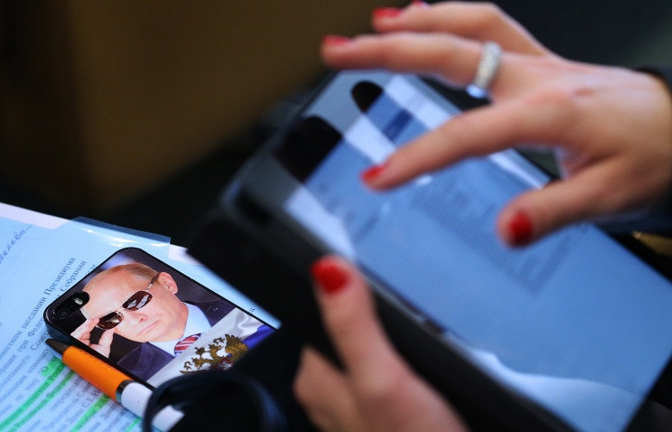 Bất chấp nền kinh tế đang ở giai đoạn khó khăn, Tổng thống Putin vẫn chiếm được cảm tình của người dân Nga. Ảnh: Tass